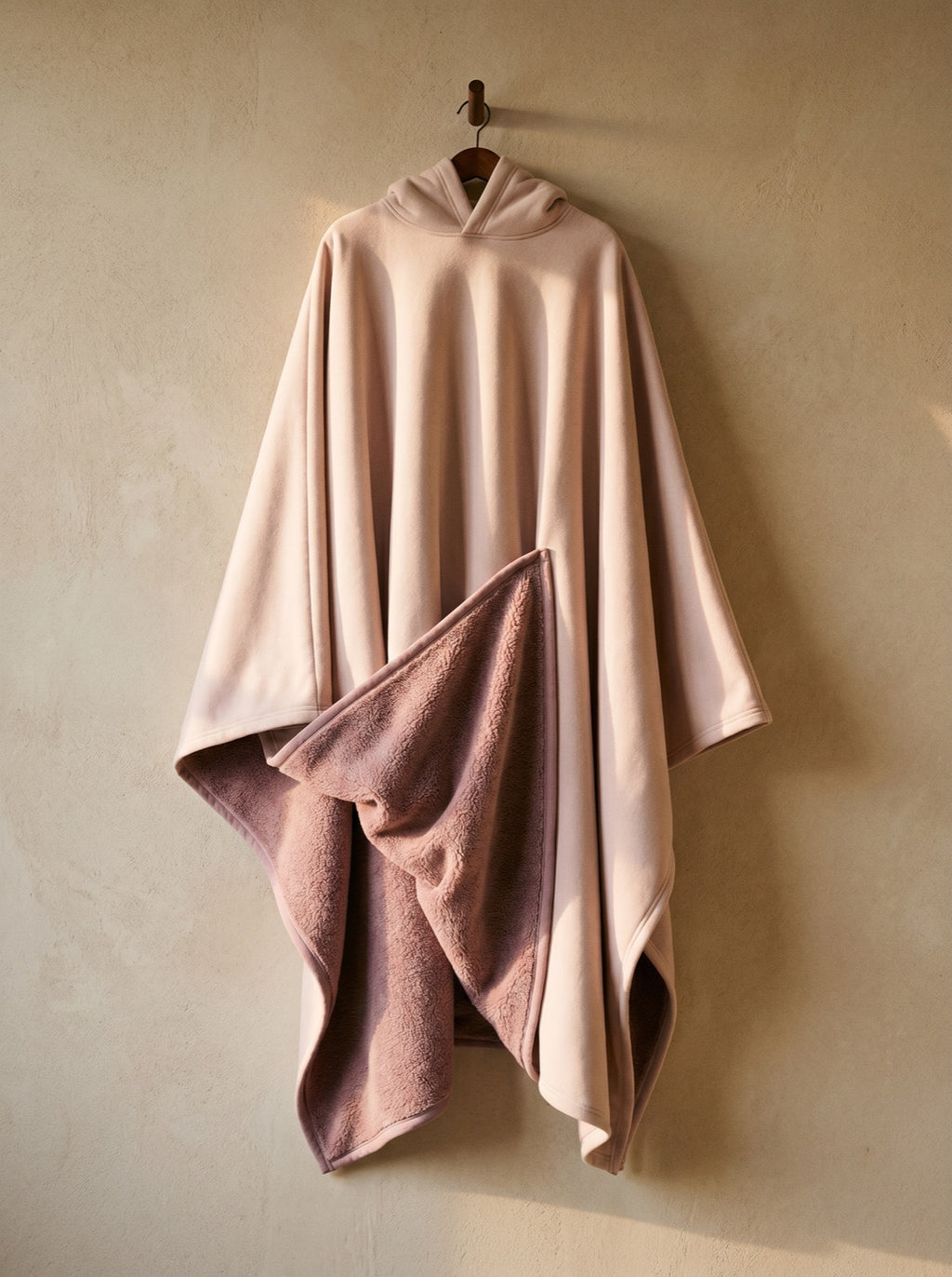 Rose — The Exhale, hung, corner folded back to show the deep-pile sherpa interior